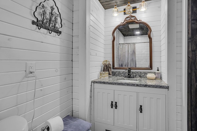 10526 Spring Arbor Rd, Spring Arbor, MI 49283 - full bath with vanity, wooden walls, a shower with shower curtain, and toilet