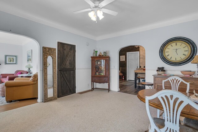 10526 Spring Arbor Rd, Spring Arbor, MI 49283 - carpeted dining area featuring arched walkways and ceiling fan