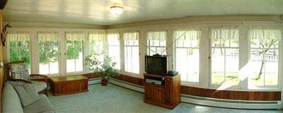 5295 Belding Rd NE, Rockford, MI 49341 - sunroom / solarium featuring baseboard heating, french doors, and a baseboard radiator