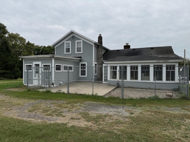 5295 Belding Rd NE, Rockford, MI 49341 - back of property with a patio and a chimney