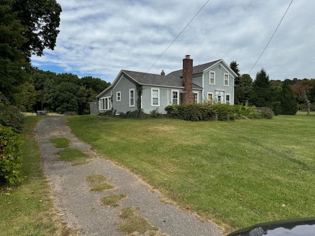 view of side of home featuring a yard