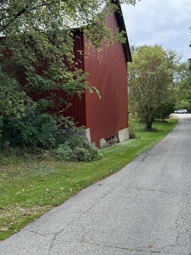 5295 Belding Rd NE, Rockford, MI 49341 - view of home's exterior with an outdoor structure and an outbuilding