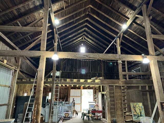 5295 Belding Rd NE, Rockford, MI 49341 - misc room featuring high vaulted ceiling and wood walls