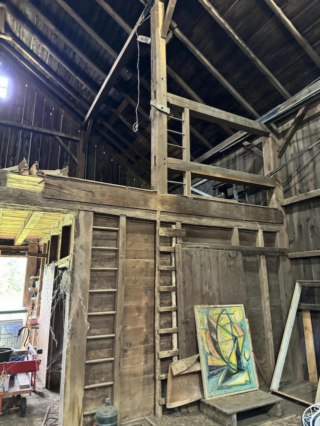 5295 Belding Rd NE, Rockford, MI 49341 - miscellaneous room with lofted ceiling and wooden walls