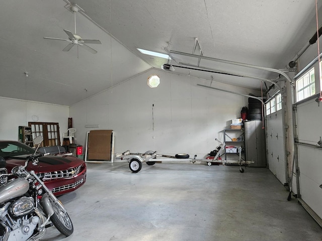 garage featuring a garage door opener and ceiling fan