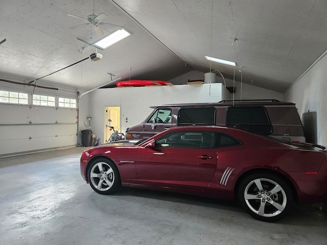 garage featuring ceiling fan and a garage door opener