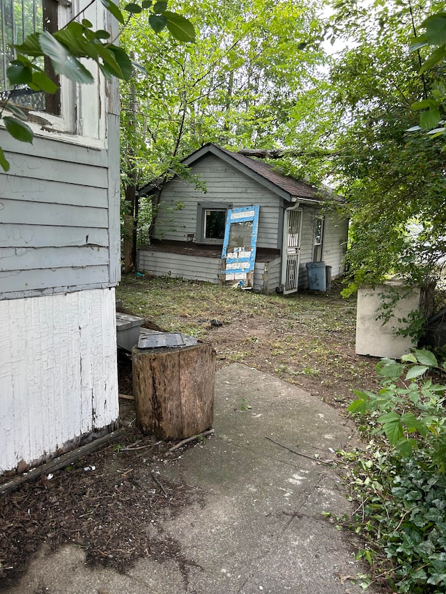 view of patio / terrace featuring an outbuilding