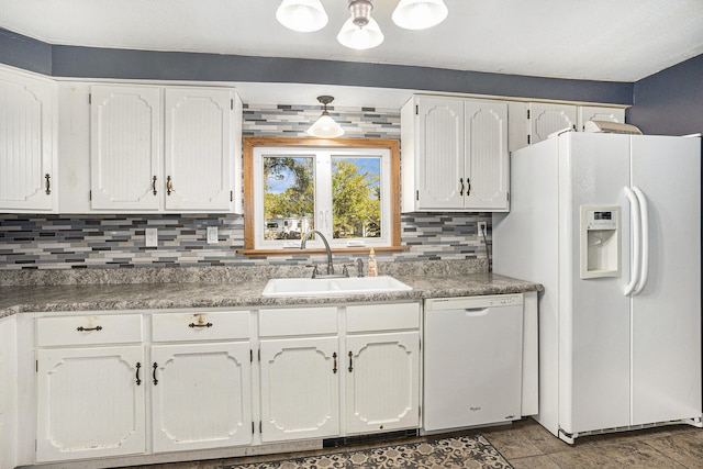 kitchen with backsplash, white cabinetry, white appliances, and sink