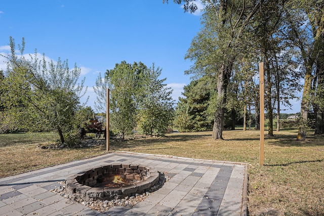 view of patio / terrace with an outdoor fire pit