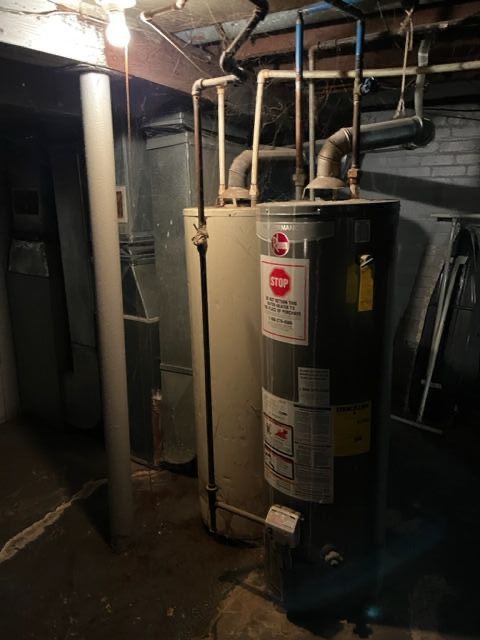 utility room with gas water heater