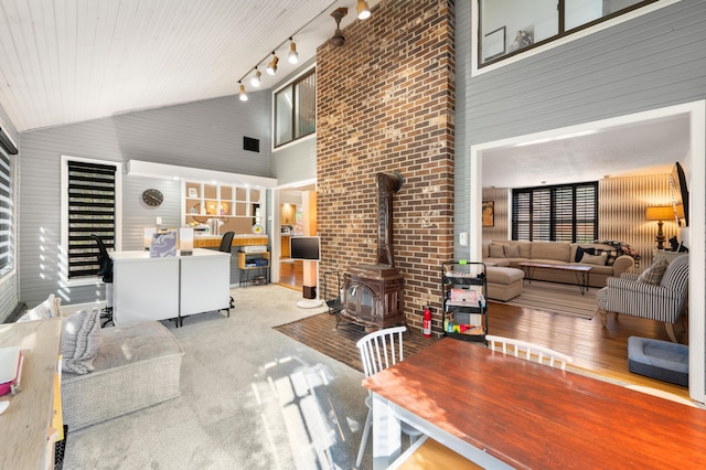 20616 Madison Ave, Big Rapids, MI 49307 - living area featuring high vaulted ceiling and a wood stove