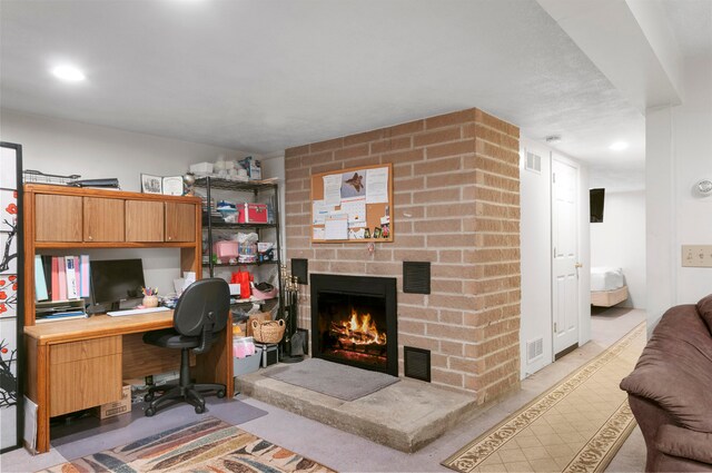 office space featuring a brick fireplace