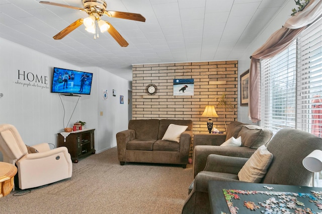 living room featuring light carpet and ceiling fan