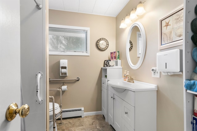 bathroom with vanity and a baseboard radiator