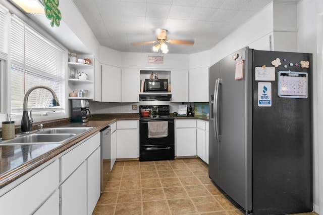 kitchen featuring white cabinetry, sink, and black appliances