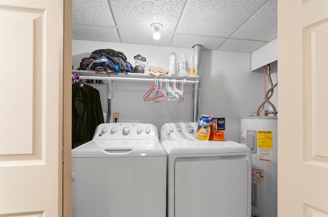 washroom featuring washing machine and dryer and electric water heater