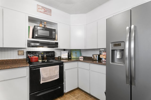 kitchen featuring white cabinetry, dark stone countertops, light tile patterned floors, black appliances, and ornamental molding