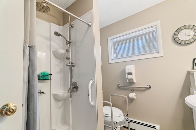 bathroom featuring a shower with curtain, a baseboard radiator, and toilet