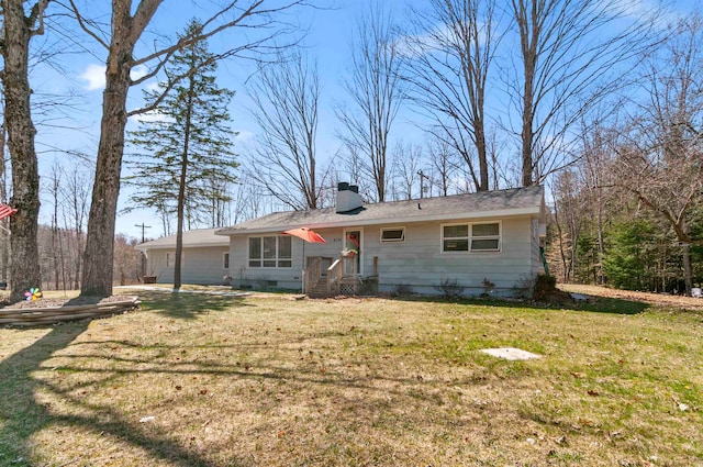 rear view of house with a lawn