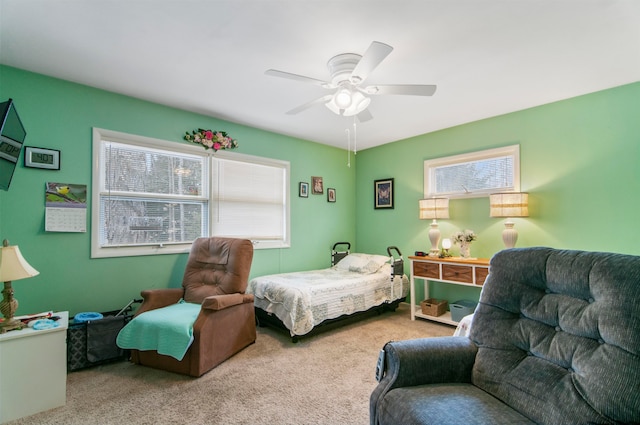 bedroom featuring ceiling fan and light colored carpet