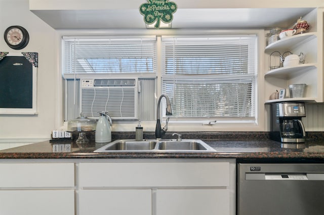 kitchen with stainless steel dishwasher, white cabinetry, and sink