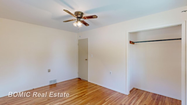 unfurnished bedroom featuring a closet, ceiling fan, and light hardwood / wood-style flooring