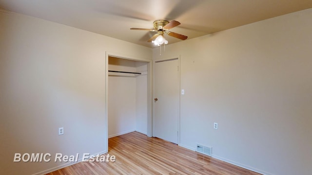 unfurnished bedroom featuring a closet, ceiling fan, and light hardwood / wood-style flooring