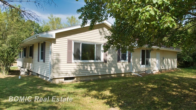 view of home's exterior featuring a lawn