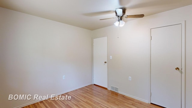 unfurnished bedroom with light wood-type flooring and ceiling fan