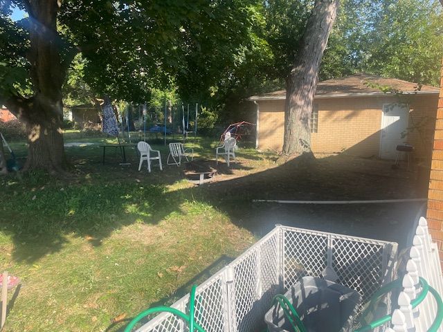 view of yard with a trampoline