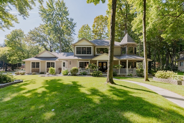 view of front facade featuring a front lawn and covered porch