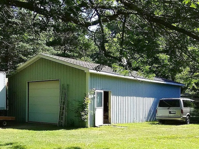 garage featuring a yard