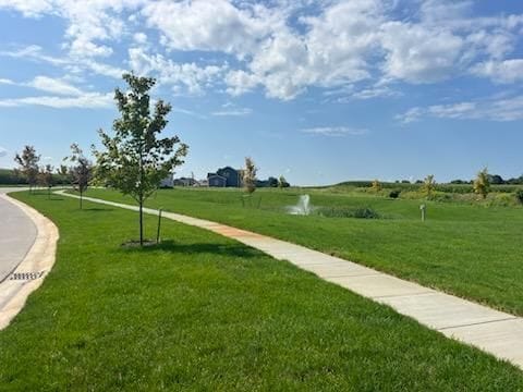 surrounding community featuring a lawn