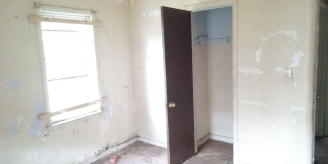 unfurnished bedroom with a closet