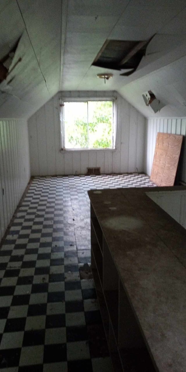 additional living space featuring vaulted ceiling