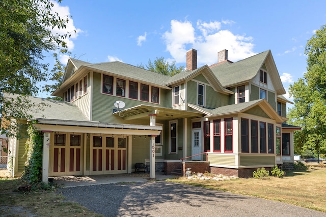 view of front of property with a sunroom