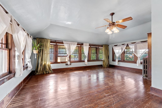 unfurnished living room with ceiling fan, cooling unit, and dark hardwood / wood-style flooring