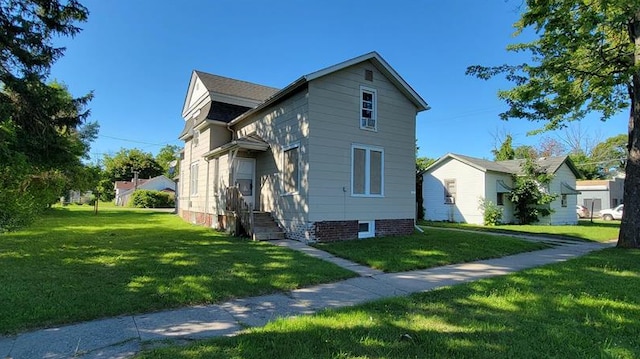 view of home's exterior with a lawn