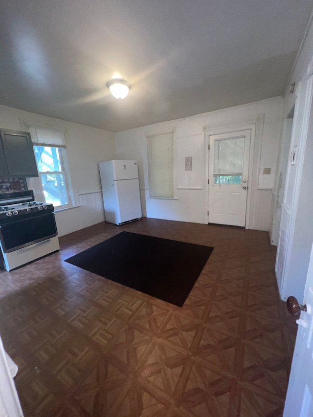 kitchen with dark parquet floors and white appliances