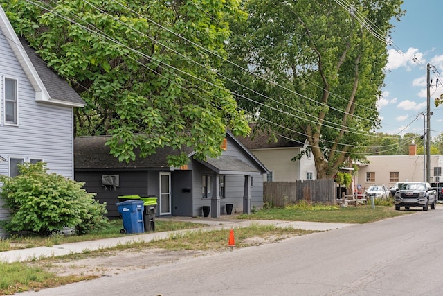 120 N Cedar St, Traverse City, MI 49684 - view of front of property with roof with shingles