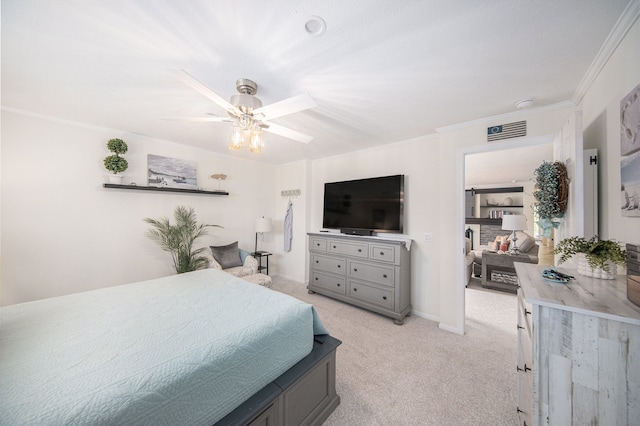 carpeted bedroom with ceiling fan and ornamental molding