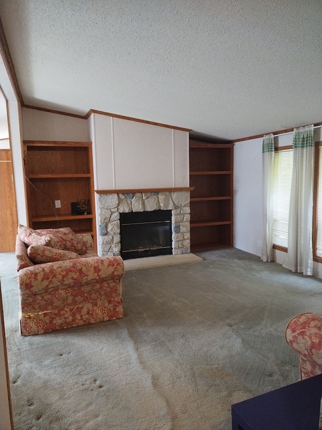 unfurnished living room featuring a fireplace, a textured ceiling, carpet floors, and ornamental molding