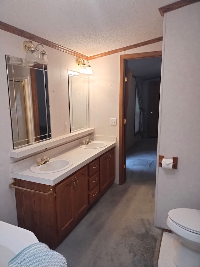 bathroom with vanity, a textured ceiling, toilet, and ornamental molding