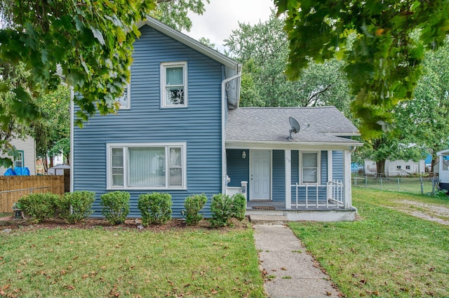 view of front of property with a porch and a front yard