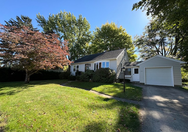 view of front of property with a garage and a front yard