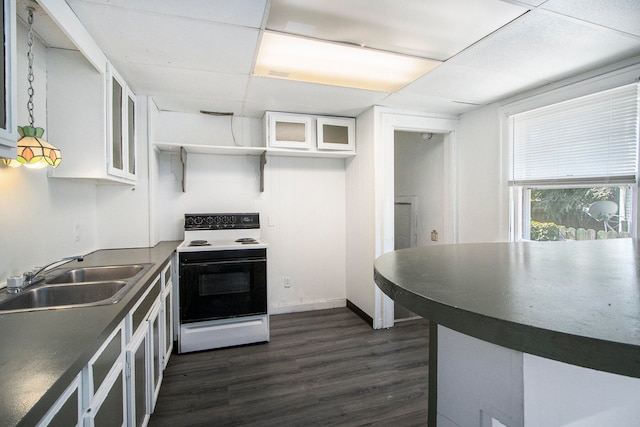 kitchen featuring dark hardwood / wood-style flooring, a drop ceiling, sink, electric range, and white cabinets