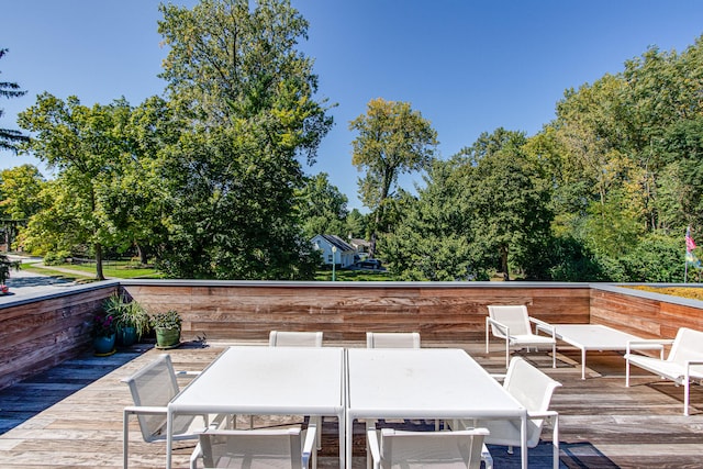 wooden deck featuring outdoor dining space