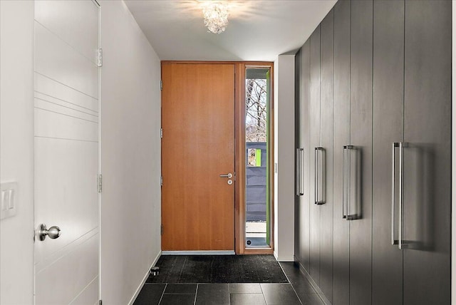 entryway featuring baseboards