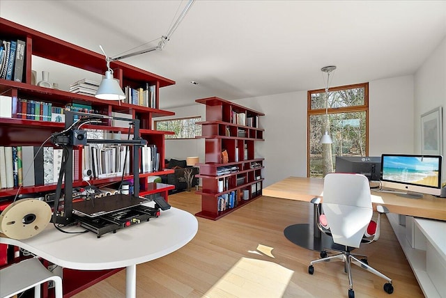 home office with wood finished floors