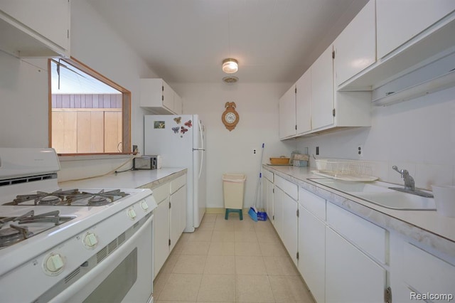 kitchen featuring white cabinets, white appliances, and sink